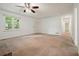 Spacious living room features a ceiling fan and large window with plenty of natural light at 2900 Country Nw Ct, Kennesaw, GA 30152