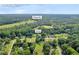 Scenic aerial shot of an Auburn, GA neighborhood, pinpointing Wages Rd and a home surrounded by lush greenery at 483 Glen Terrace Rd, Auburn, GA 30011