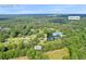 Aerial view of home with large backyard and neighborhood in Auburn, GA near Rock Creek at 483 Glen Terrace Rd, Auburn, GA 30011