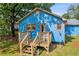 View of the house's back porch from the yard with furniture and easy access to backyard at 483 Glen Terrace Rd, Auburn, GA 30011