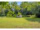 Spacious backyard with shed, offering plenty of space for activities and storage at 483 Glen Terrace Rd, Auburn, GA 30011