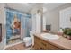 Bathroom with a single sink vanity, quirky shower curtain, and ceramic tile at 483 Glen Terrace Rd, Auburn, GA 30011