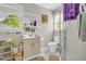 Bright bathroom featuring storage, shower and a window at 483 Glen Terrace Rd, Auburn, GA 30011