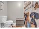 Bathroom featuring tile floors, a toilet, and a shower with a curtain at 483 Glen Terrace Rd, Auburn, GA 30011