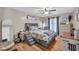 Bedroom with hardwood floors, gray furniture, and natural light at 483 Glen Terrace Rd, Auburn, GA 30011