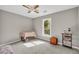 Cozy bedroom features natural light, carpet floors, and soothing neutral paint for a relaxing retreat at 483 Glen Terrace Rd, Auburn, GA 30011