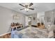 Bedroom featuring wood floors, fan, and natural light at 483 Glen Terrace Rd, Auburn, GA 30011