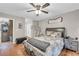 Bedroom featuring wood floors, fan, and natural light at 483 Glen Terrace Rd, Auburn, GA 30011