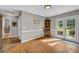 Bright dining area featuring hardwood floors and access to the backyard creating a seamless indoor-outdoor flow at 483 Glen Terrace Rd, Auburn, GA 30011