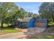 The front of this single story home features a 2-car garage and a quaint covered porch at 483 Glen Terrace Rd, Auburn, GA 30011