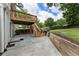 Beautiful backyard with a deck and stairs leading to a concrete patio at 1972 Wingate Rd, Chamblee, GA 30341
