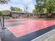 Spacious, well-maintained basketball court with Atlanta Hawks team logos and brick building in background at 1972 Wingate Rd, Chamblee, GA 30341