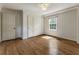 Empty bedroom showcasing hardwood floors, neutral walls, and natural light at 1972 Wingate Rd, Chamblee, GA 30341