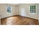 An empty bedroom features hardwood floors and two bright windows at 1972 Wingate Rd, Chamblee, GA 30341