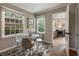 Bright dining area features hardwood floors, a modern table with chairs, and natural lighting at 1972 Wingate Rd, Chamblee, GA 30341