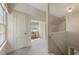 Hallway featuring neutral carpet with a seating area and bright window at 1972 Wingate Rd, Chamblee, GA 30341