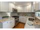 Stylish kitchen with white cabinetry, stainless steel appliances, and marble countertops at 1972 Wingate Rd, Chamblee, GA 30341