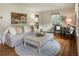 Bright living room featuring neutral colors, hardwood floors, a comfortable sofa, and stylish decor at 1972 Wingate Rd, Chamblee, GA 30341