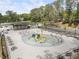 Community splash pad with playground equipment, picnic tables, and a shade structure at 1972 Wingate Rd, Chamblee, GA 30341