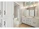 Bright bathroom with double vanity, tile flooring, and separate tub and shower areas at 200 River Pass Trl, Atlanta, GA 30350