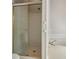 Shower room with glass door and white tile with a tub at 200 River Pass Trl, Atlanta, GA 30350