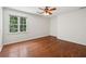 Bedroom featuring hardwood floors, one window, and ceiling fan at 200 River Pass Trl, Atlanta, GA 30350