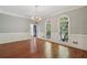 Elegant dining room featuring hardwood floors, wainscoting, and a chandelier at 200 River Pass Trl, Atlanta, GA 30350