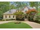 Stunning stucco home with manicured lawn and mature trees, showcasing curb appeal at 200 River Pass Trl, Atlanta, GA 30350