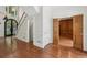 Elegant foyer features hardwood floors, staircase, and front door at 200 River Pass Trl, Atlanta, GA 30350
