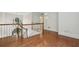 Staircase with hardwood floors and railing at 200 River Pass Trl, Atlanta, GA 30350