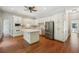 Well-lit kitchen featuring white cabinetry, stainless steel appliances, and an island at 200 River Pass Trl, Atlanta, GA 30350