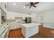Bright kitchen featuring an island, stainless steel appliances, and ample cabinet space at 200 River Pass Trl, Atlanta, GA 30350