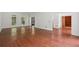 Sun-filled living room featuring hardwood floors, large windows, and detailed trim at 200 River Pass Trl, Atlanta, GA 30350