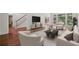 Bright living room with hardwood floors, neutral furnishings, and large windows at 200 River Pass Trl, Atlanta, GA 30350
