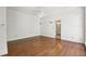 Spacious living room with hardwood floors and sconce lighting at 200 River Pass Trl, Atlanta, GA 30350