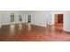 Open floor plan showcasing hardwood floors, large windows, and seamless transition to other rooms at 200 River Pass Trl, Atlanta, GA 30350