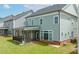Back of the house with covered patio area and green lawn at 2222 Haventree Ct, Lawrenceville, GA 30043