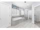 Bathroom boasts a soaking tub, glass enclosed shower, and tile floors at 2222 Haventree Ct, Lawrenceville, GA 30043
