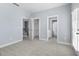 Spacious carpeted bedroom with multiple closets and bright natural light at 2222 Haventree Ct, Lawrenceville, GA 30043