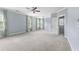 Spacious bedroom features multiple windows with curtains, ceiling fan, and neutral walls at 2222 Haventree Ct, Lawrenceville, GA 30043