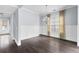 Charming dining room features hardwood floors, wainscoting and elegant chandelier at 2222 Haventree Ct, Lawrenceville, GA 30043