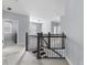 Hallway with view of stairway and bedrooms, laundry room and ample natural light at 2222 Haventree Ct, Lawrenceville, GA 30043