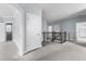 Hallway features neutral walls, plush carpet, and a dark railing that overlooks stairs at 2222 Haventree Ct, Lawrenceville, GA 30043