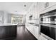 Gourmet kitchen with stainless steel appliances, a center island, and dark hardwood flooring at 2222 Haventree Ct, Lawrenceville, GA 30043
