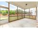 Screened porch with view of the backyard and surrounding trees at 2222 Haventree Ct, Lawrenceville, GA 30043