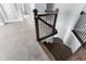 Carpeted staircase with a wooden handrail and black iron balusters at 2222 Haventree Ct, Lawrenceville, GA 30043