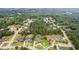 An aerial view showcases a neighborhood surrounded by lush greenery and beautiful homes at 3364 Kylee Dawn Cir, Lawrenceville, GA 30045