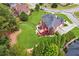 Captured from an aerial perspective, discover the backyard, complete with a deck, patio furniture, and a spacious lawn at 3364 Kylee Dawn Cir, Lawrenceville, GA 30045