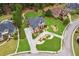 Aerial view of a lush, green neighborhood with beautiful homes and well-maintained lawns at 3364 Kylee Dawn Cir, Lawrenceville, GA 30045