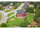 Beautiful aerial view of a home with lush backyard landscaping, multi-level deck, and patio furniture at 3364 Kylee Dawn Cir, Lawrenceville, GA 30045